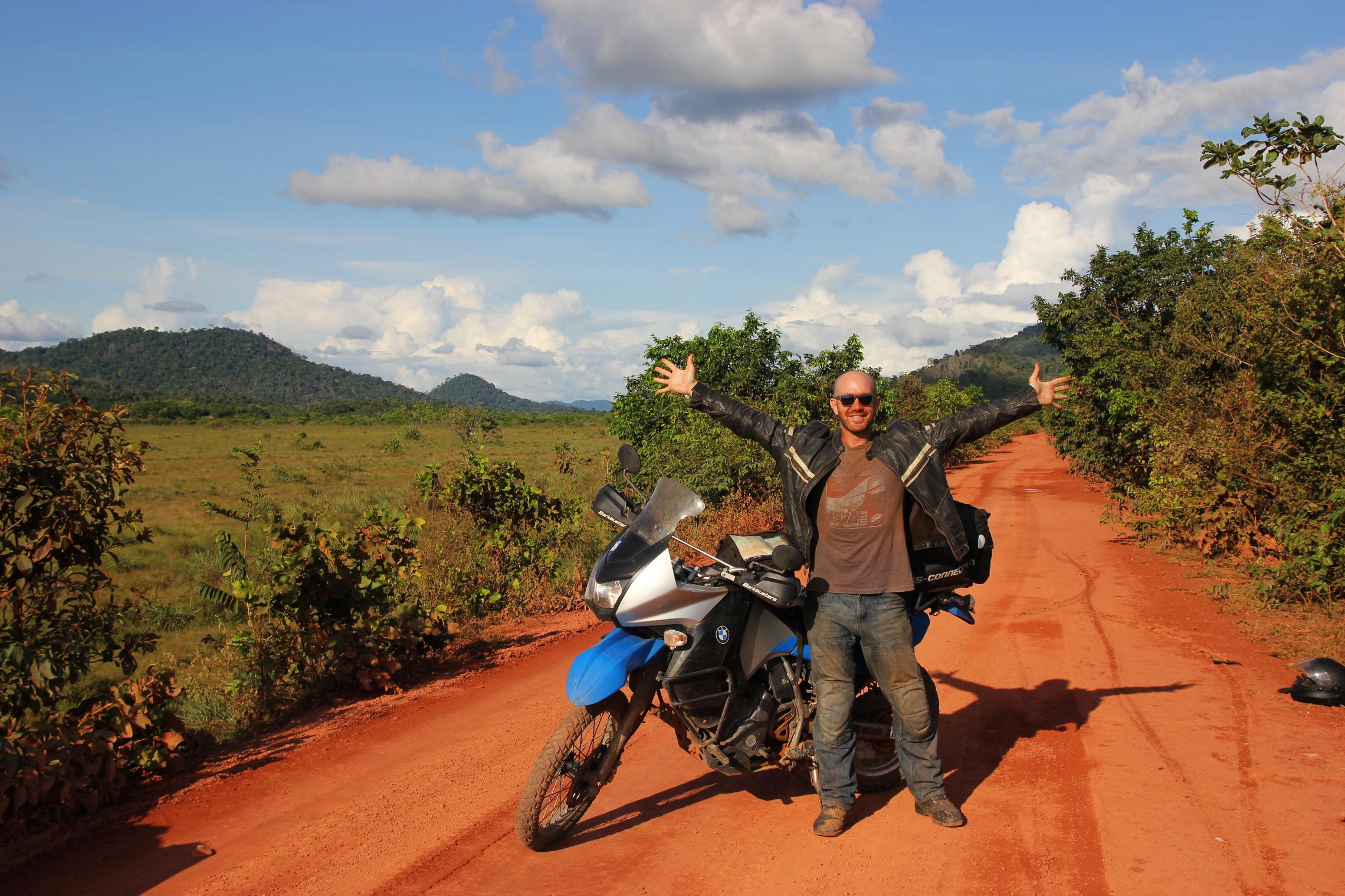 10,000 miles - The road to Annai, Guyana -- This dirt road is actually the big international highway through the Guyanese interior. It was still fun and games before we entered the rainforest.